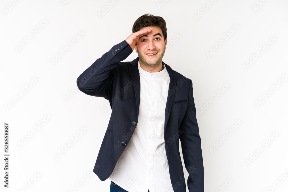 Young business man isolated on white background shouts loud, keeps eyes opened and hands tense. Young business man isolated on white background shouts loud, keeps eyes opened and hands tense.