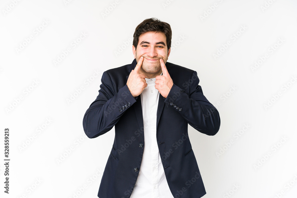 Young business man isolated on white background doubting between two options. Young business man isolated on white background doubting between two options.