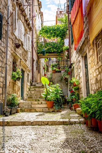 Colorful stairs in Dubrovnik Old Town with plants and pots