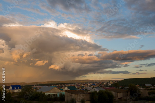 Dark blue grey sky with much rainy clouds before storm.  Background of heaven. Beautiful evening