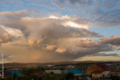 Dark blue grey sky with much rainy clouds before storm.  Background of heaven. Beautiful evening