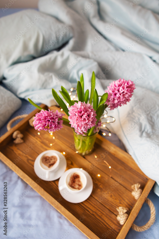 Bouquet of hyacinths, two cups of cappuccino. Place for an inscription.