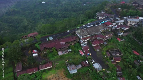 Aerial view from drone bird eye view rice cultivation in Asia agriculture near the equator ripe seasonal crop countryside and cultivation rural area with peasants and workers photo