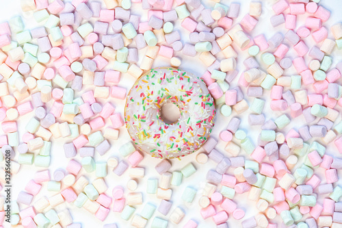 donut in a round marshmallow frame on a white background. top view photo