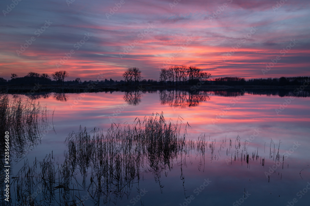 Wonderful colorful clouds over the lake after sunset, calm and beauty nature