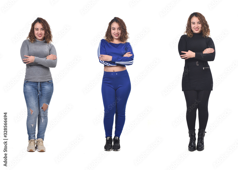 the same woman with casual elegant clothes and sportswear, arms crossed the same woman with casual elegant clothes and sportswear, arms crossed