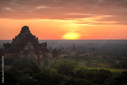 Sunrise above old pagodas misty with amazing clouds early morning and air balloons at Bagan  Myanmar.