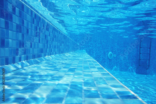 Underwater shot of stairs and tiles on pool bottom