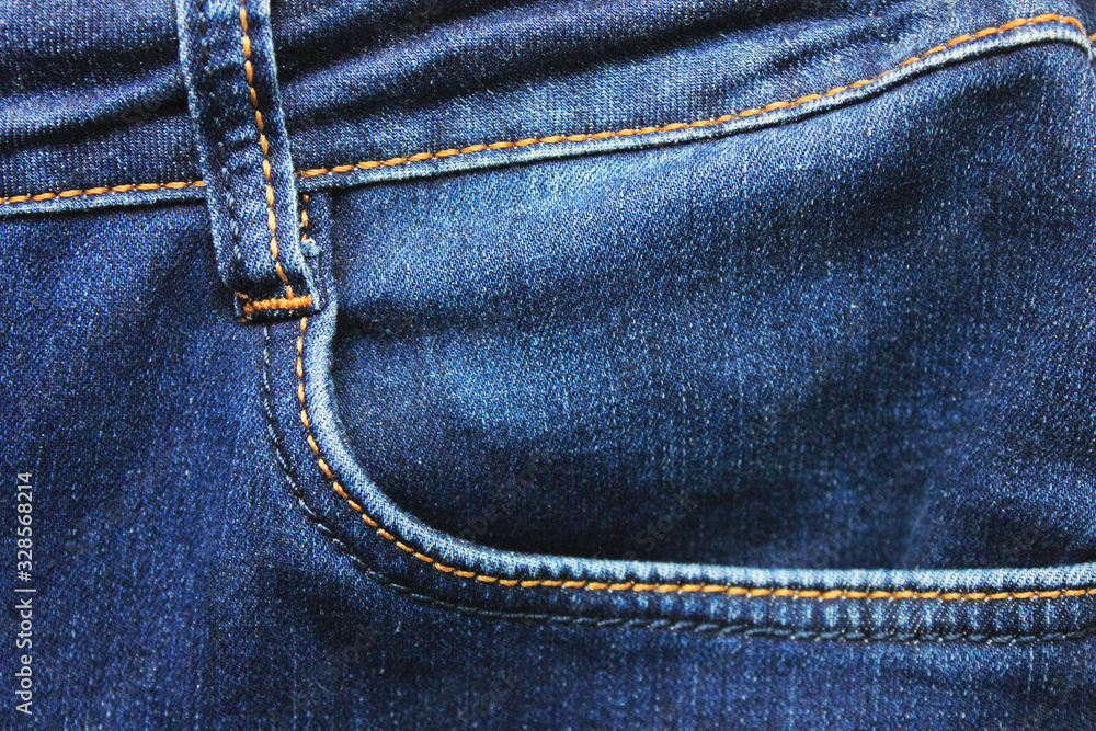 Jeans front pocket detail, plain dark denim fabric. Simple dark blue jeans clothing element, simple empty pocket with seams Jeans front pocket detail, plain dark denim fabric. Simple dark blue jeans clothing element, simple empty pocket with seams