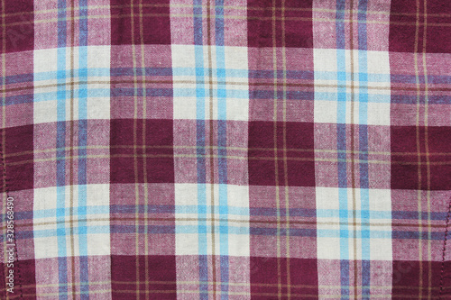 Tartan flannel pattern, stylish tablecloth element or shirt detail. Buffalo style scottish celtic design, purple and white color lumberjack cloth background