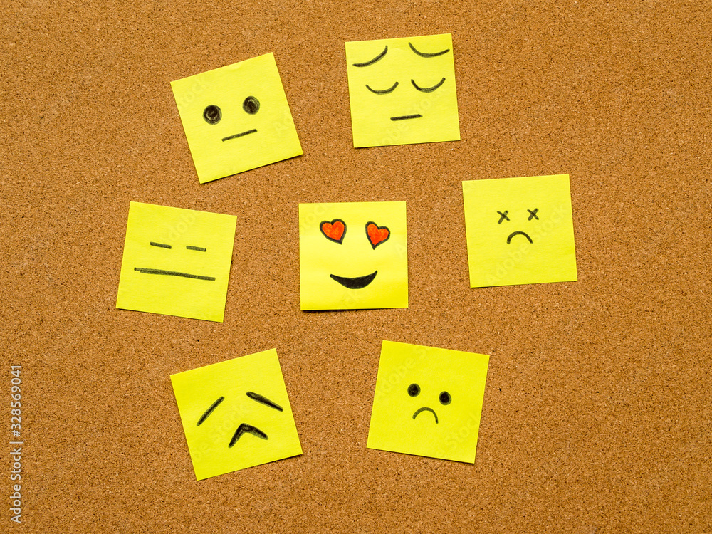 note papers with smiley faces on cork board office concept photo note papers with smiley faces on cork board office concept photo