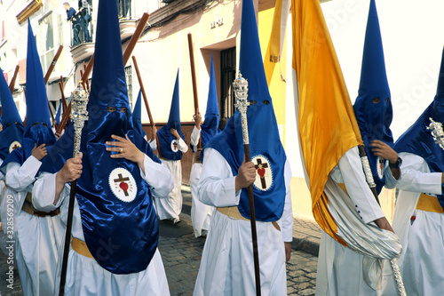 Seville, Spain - April 14, 2019: Penitents of the Hermandad de La Hiniesta procession in Seville on Domingo de Ramos/Palm Sunday