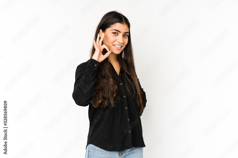 Young indian woman isolated on purple background cheerful and confident showing ok gesture. Young indian woman isolated on purple background cheerful and confident showing ok gesture.