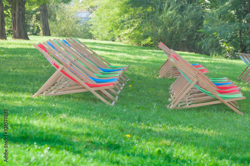 Red, Green and Blue coloured Folded Deck Chairs © aureliano1704