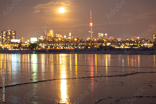Photography Frozen lake with the city of toronto in the background
