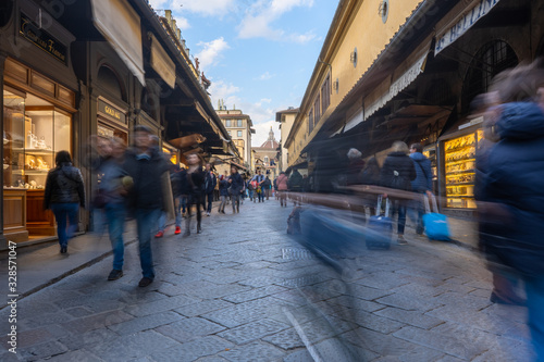 People walking on the Ponte Vecchio in Florence in the daytime