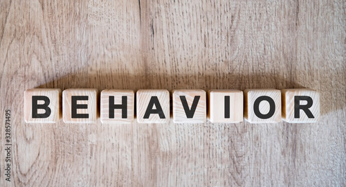 Behavior text word on wooden cubes on wooden background
