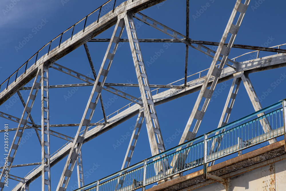 Steel bridge frame close. Bridge over the winter river