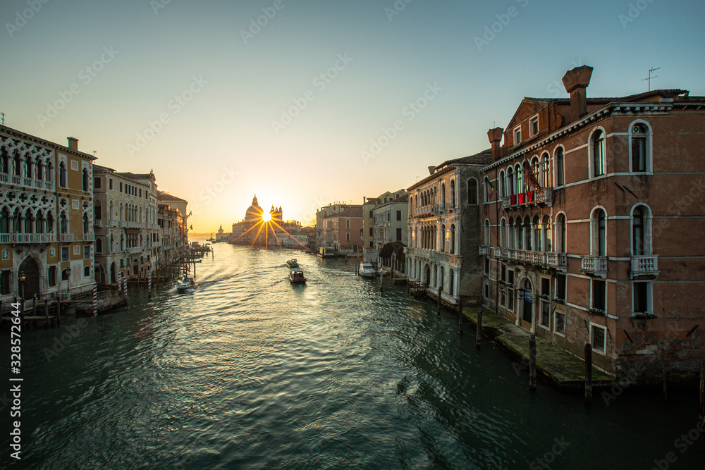 canal in Venice, sunrise over the church