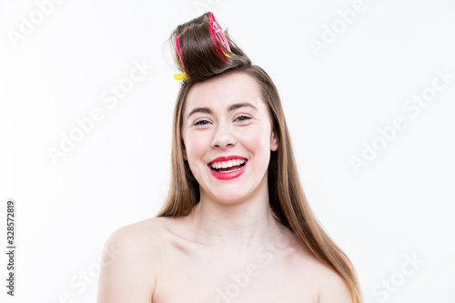 Hair styling. Portrait of beautiful woman on white background