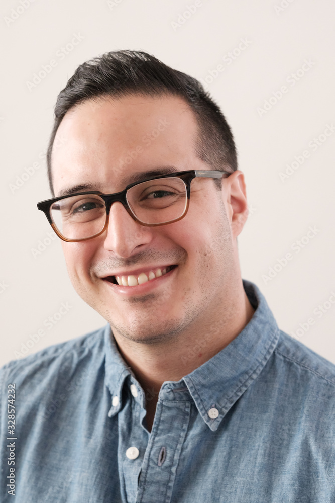 portrait of a happy young man wearing stylish glasses portrait of a happy young man wearing stylish glasses
