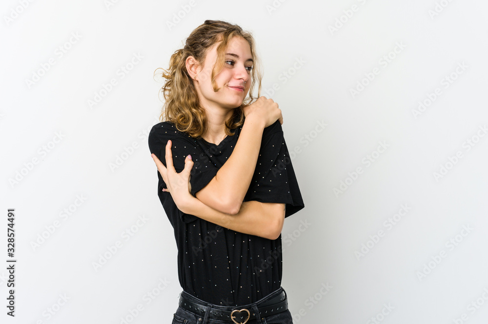 Young caucasian woman on white backrgound hugs, smiling carefree and happy. Young caucasian woman on white backrgound hugs, smiling carefree and happy.