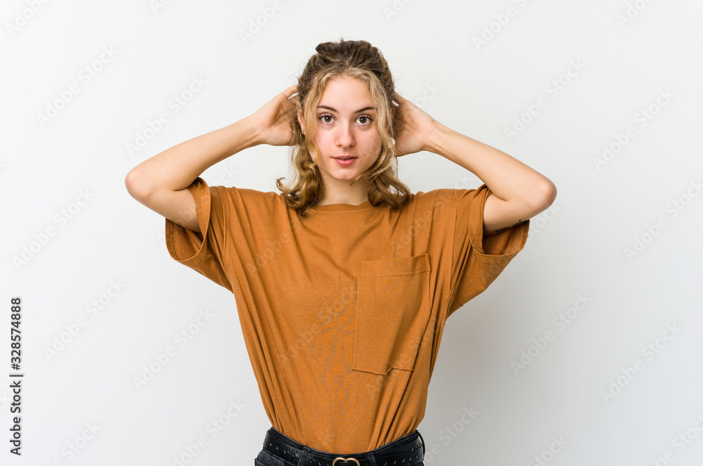 Young caucasian woman on white backrgound screaming, very excited, passionate, satisfied with something.