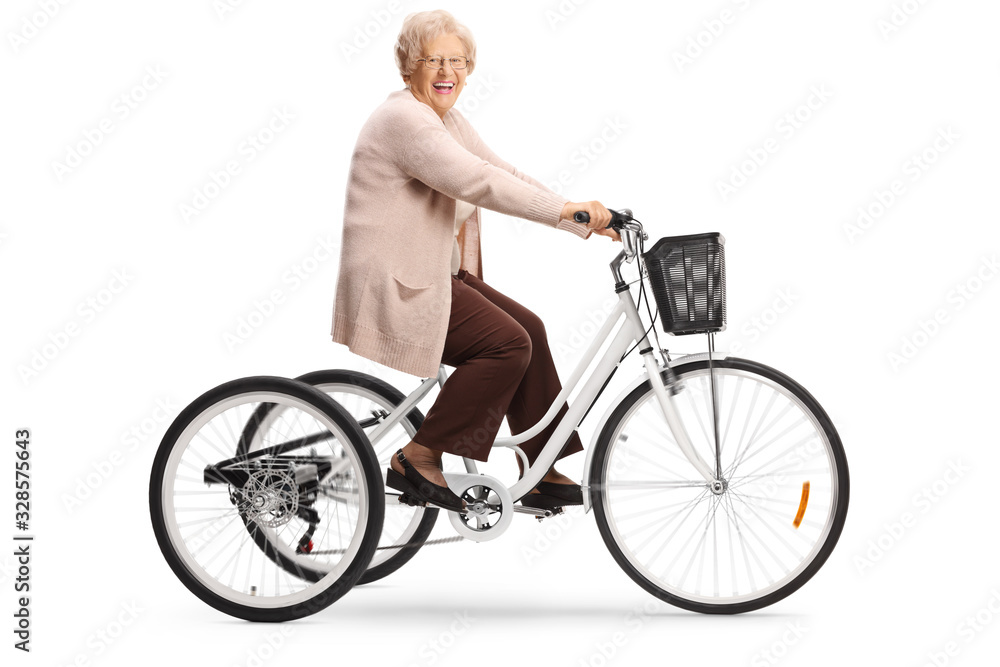 Senior woman riding a tricycle and laughing Senior woman riding a tricycle and laughing