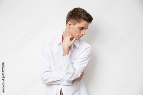 Portrait of young attractive man on white background © Coolpicture