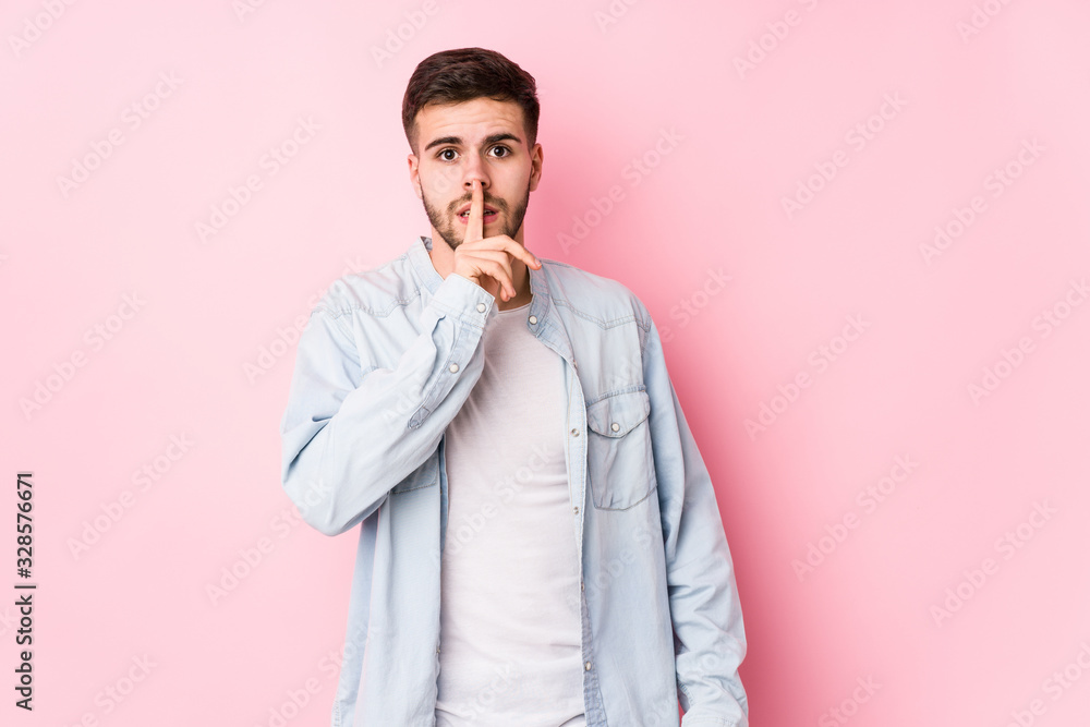 Young caucasian business man posing in a white background isolated keeping a secret or asking for silence.< mixto > Young caucasian business man posing in a white background isolated keeping a secret or asking for silence.< mixto >
