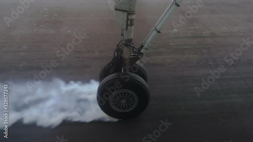 Wallpaper Mural Skidding commercial airplane tire producing white rubber smoke by making contact with the runway in slow motion. Torontodigital.ca