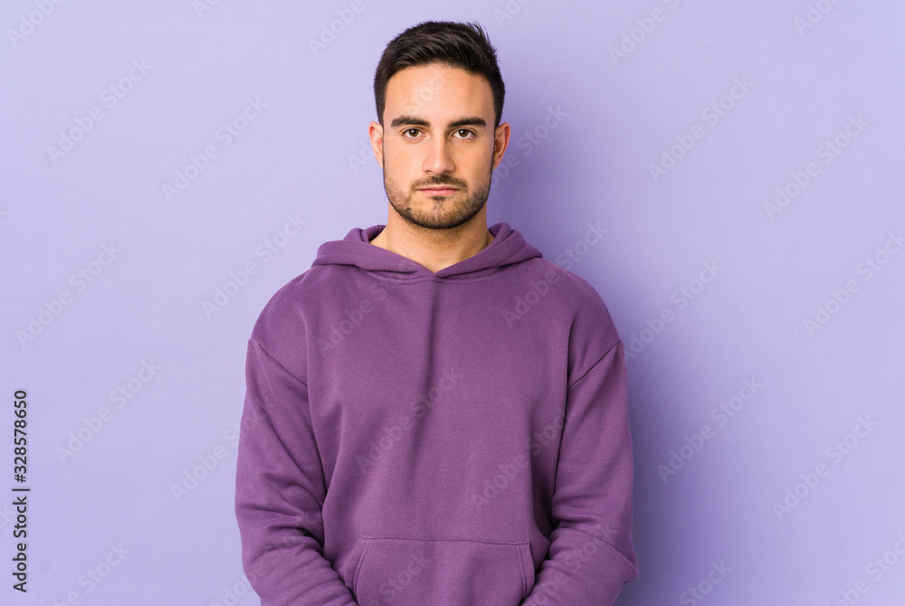 Young caucasian man isolated on purple background sad, serious face, feeling miserable and displeased. Young caucasian man isolated on purple background sad, serious face, feeling miserable and displeased.