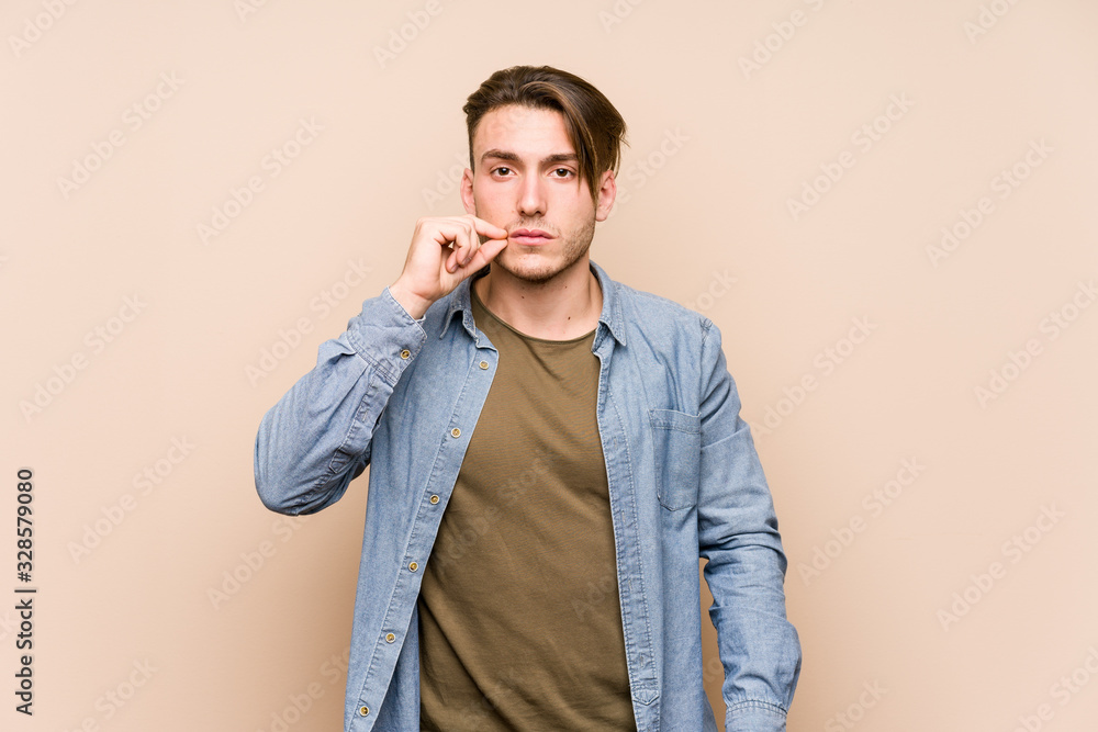 Young caucasian man posing isolated with fingers on lips keeping a secret. Young caucasian man posing isolated with fingers on lips keeping a secret.