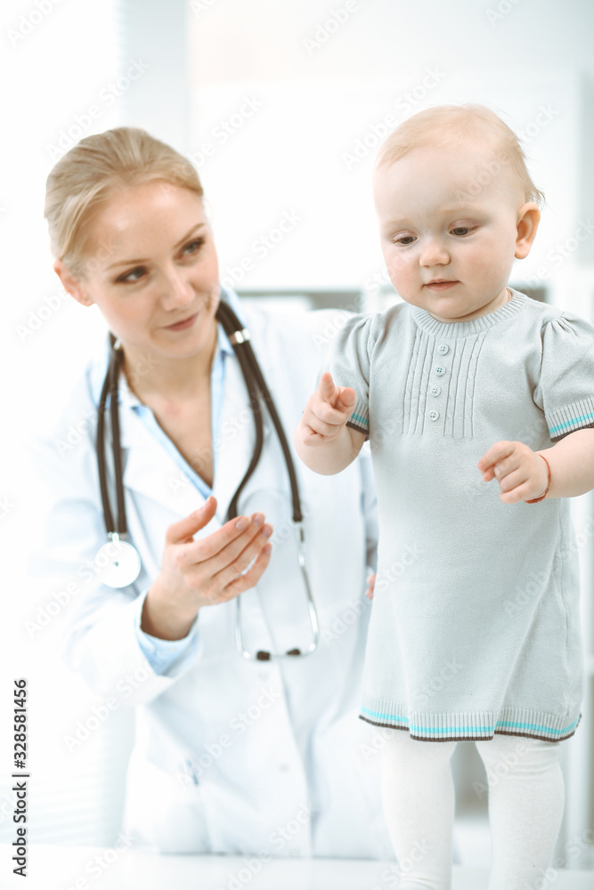 Doctor and patient in hospital. Little girl is being examined by doctor with stethoscope. Medicine concept Doctor and patient in hospital. Little girl is being examined by doctor with stethoscope. Medicine concept