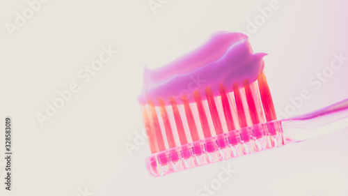 Pink plastic toothbrush with a thick layer of white toothpaste on an isolated background.