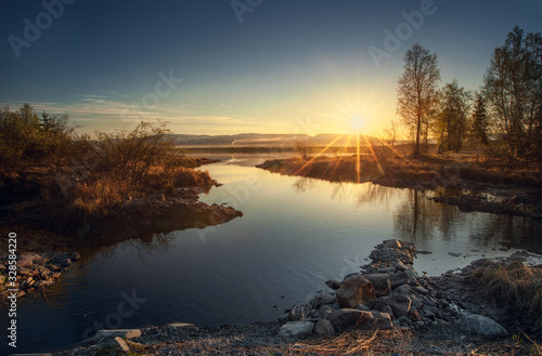 Morning sunrise on Lake Imandra. Against the backdrop of the Khibiny Mountains, Murmansk Region, Kola Peninsula.