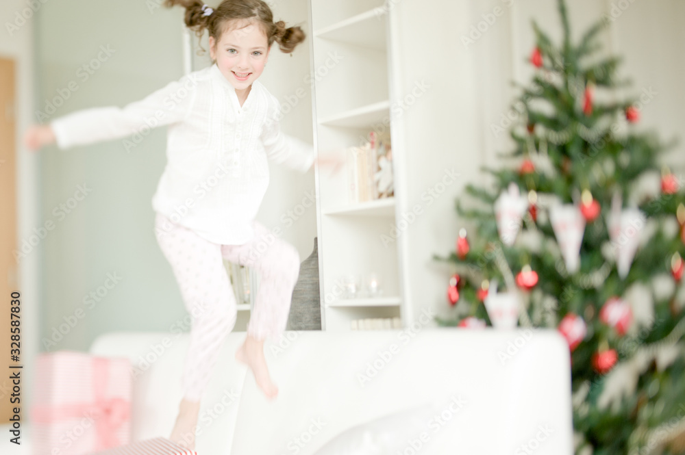 Cute child enjoying Christmas atmosphere Cute child enjoying Christmas atmosphere