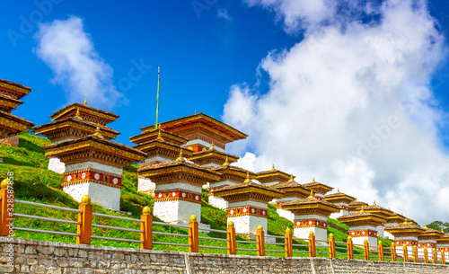 Dochula pass on a bright sky day, 108 memorial chortens or stupas known as Druk Wangyal Chortens, Thimphu city, Bhutan photo