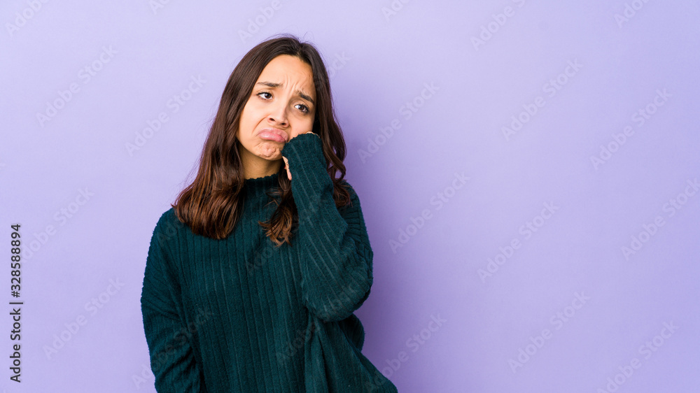 Young mixed race hispanic woman isolated who feels sad and pensive, looking at copy space. Young mixed race hispanic woman isolated who feels sad and pensive, looking at copy space.