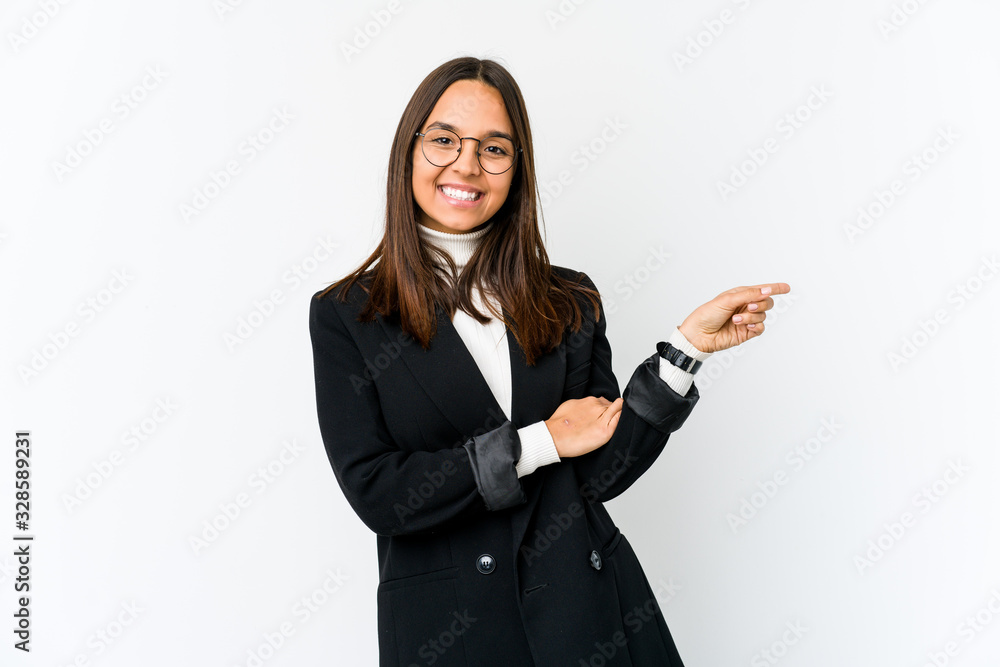 Young mixed race business woman isolated on white background smiling cheerfully pointing with forefinger away. Young mixed race business woman isolated on white background smiling cheerfully pointing with forefinger away.