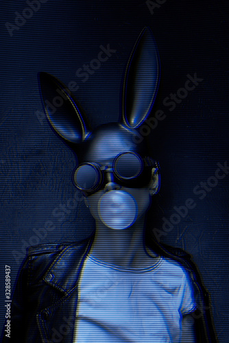 masked easter bunny blowing bubble gum bubbles. Easter party concept
