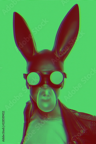 Obraz na płótnie masked easter bunny blowing bubble gum bubbles. Easter party concept w salonie
