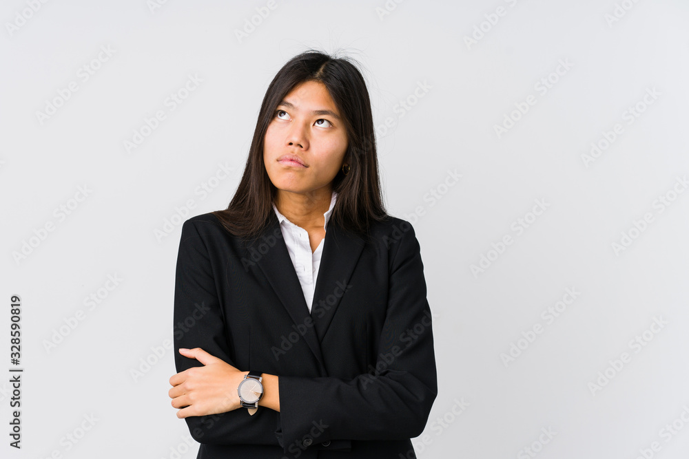 Young asian business woman tired of a repetitive task. Young asian business woman tired of a repetitive task.