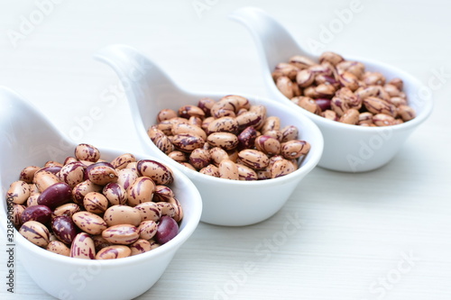 Raw bean grains (Phaseolus vulgaris) displayed in bowl