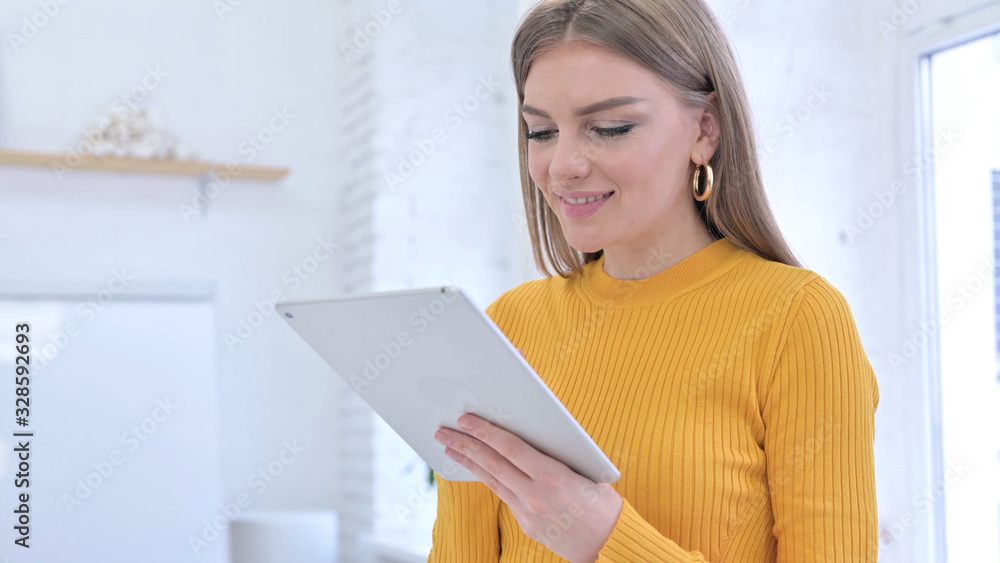 Happy Young Creative Female Designer using Tablet Happy Young Creative Female Designer using Tablet