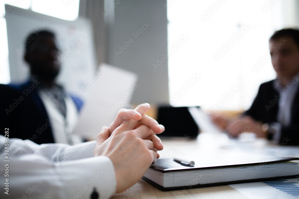 An approximate photo of the hands of a businessman with a diary on a blurred background An approximate photo of the hands of a businessman with a diary on a blurred background