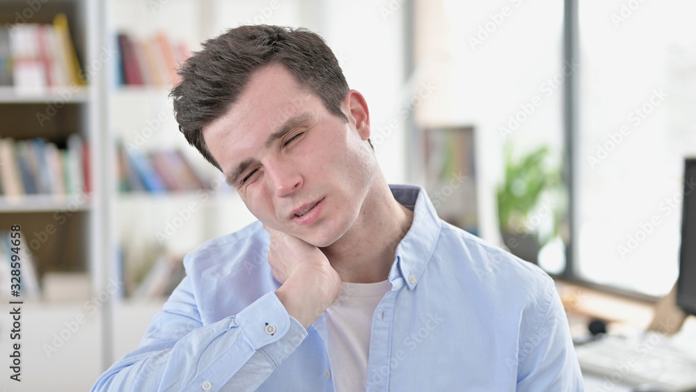Tired Young Man with Neck Pain Tired Young Man with Neck Pain