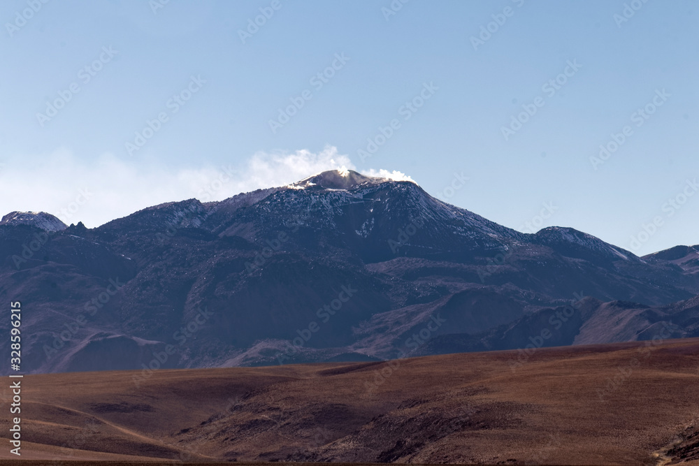 Chile – The stony desert of Atacama with the Andean mountains in the background. Chile – The stony desert of Atacama with the Andean mountains in the background.