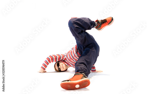 Fotografija a little boy in a unique breakdance pose, a unique dance position, a crazy kid