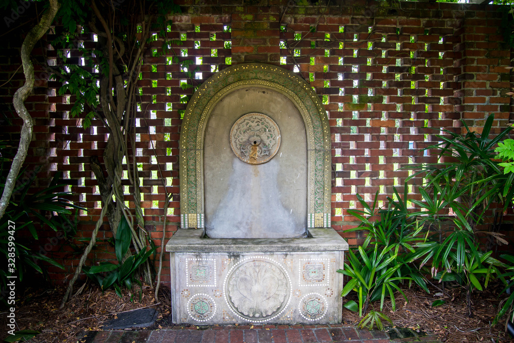 Obraz premium Flat stone fountain in a garden